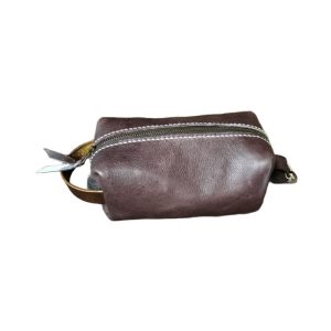 Handcrafted full-grain leather toiletry bag with brass zip & contrast stitching. Compact, durable & travel-ready. Made by hand in Port Elizabeth, SA. Shop Dragonfly Leather.