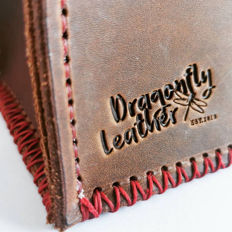 brown leather wine carrier