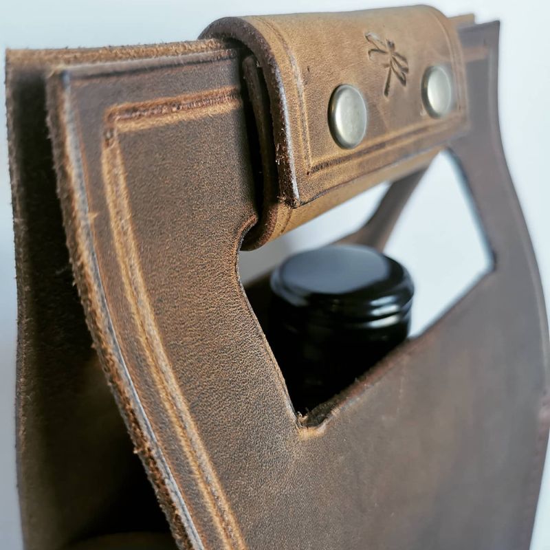 brown leather wine carrier