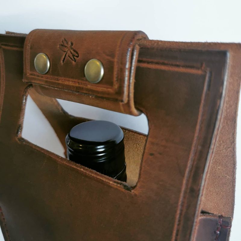 brown leather wine carrier