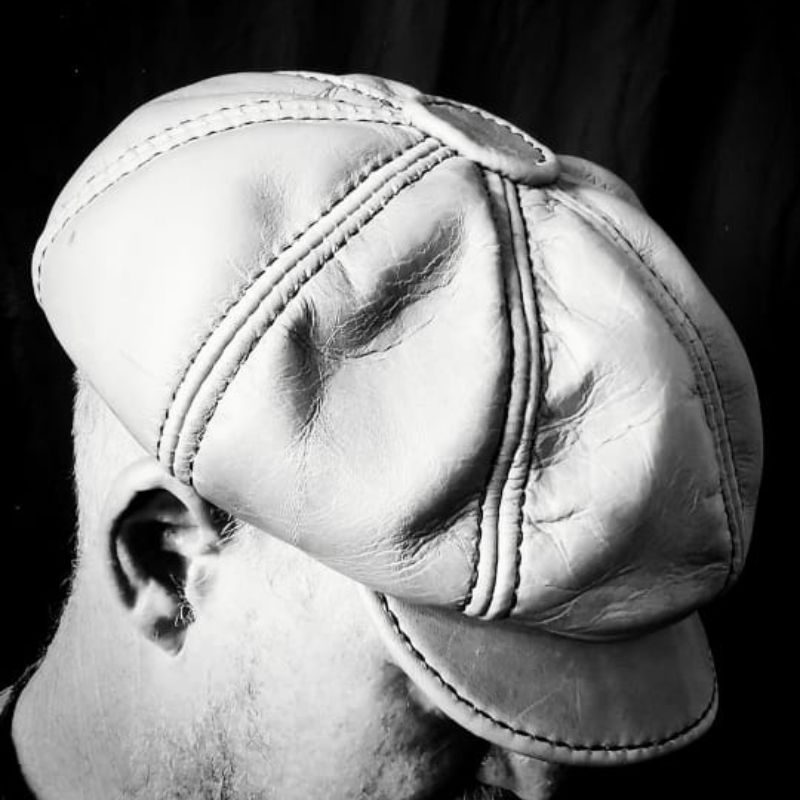 Brown leather newsletterboy caps